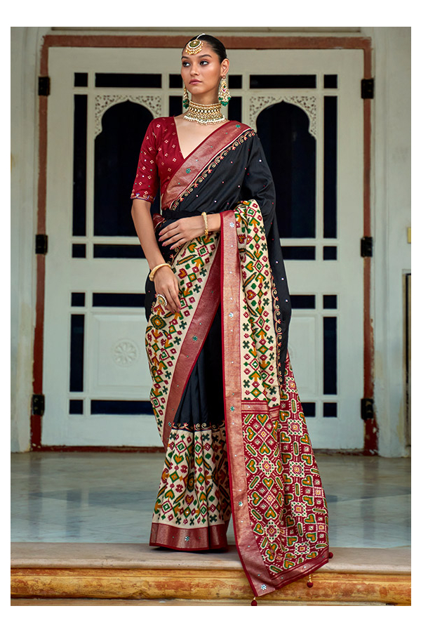 Black and red color muslin silk saree with patola printed work